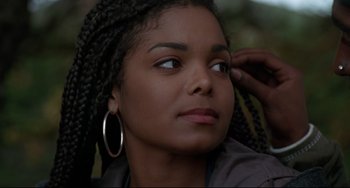 Movie still from “Poetic Justice” (1993), directed by John Singleton – A person with long braids; Close Up shot, Over the shoulder angle