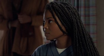 Movie still from “Poetic Justice” (1993), directed by John Singleton – A young girl with long braids looking into the distance; Close Up shot, Over the shoulder angle