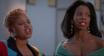 Movie still from “Poetic Justice” (1993), directed by John Singleton – Two young women standing next to each other; Close Up shot, Low angle