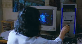 Movie still from “Poetry” (2010), directed by Lee Chang-dong – A woman sitting in front of a computer monitor; Medium shot, High angle
