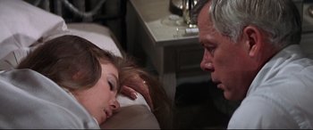 Movie still from “Point Blank” (1967), directed by John Boorman – A man and a woman laying on a bed next to each other; Close Up shot, High angle
