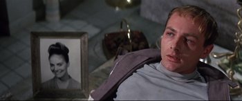 Movie still from “Point Blank” (1967), directed by John Boorman – A man laying on the ground in a room; Close Up shot, High angle