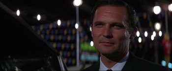 Movie still from “Point Blank” (1967), directed by John Boorman – A person wearing a suit and tie; Close Up shot, Low angle