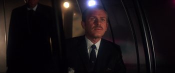 Movie still from “Point Blank” (1967), directed by John Boorman – A person wearing a suit and tie; Close Up shot, Low angle