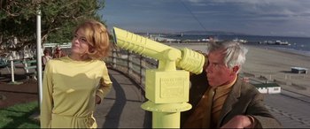 Movie still from “Point Blank” (1967), directed by John Boorman – An older man and a young girl looking at a yellow fire hydrant; Medium shot, Low angle