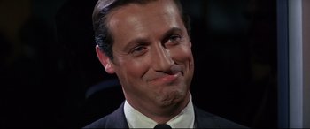 Movie still from “Point Blank” (1967), directed by John Boorman – A person wearing a suit and tie; Close Up shot, Low angle