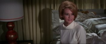Movie still from “Point Blank” (1967), directed by John Boorman – A woman in a white dress sitting in a hospital bed; Close Up shot, Over the shoulder angle