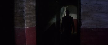 Movie still from “Point Blank” (1967), directed by John Boorman – A man is walking in a dark tunnel; Wide shot, Low angle