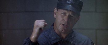 Movie still from “Point Break” (1991), directed by Kathryn Bigelow – A person wearing a hat; Close Up shot, Low angle