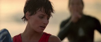 Movie still from “Point Break” (1991), directed by Kathryn Bigelow – A person with wet hair; Close Up shot, Over the shoulder angle