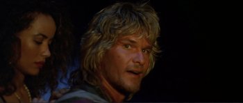 Movie still from “Point Break” (1991), directed by Kathryn Bigelow – A person with long blonde hair; Close Up shot, Low angle