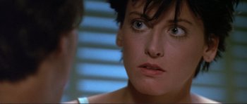 Movie still from “Point Break” (1991), directed by Kathryn Bigelow – A person looking at the camera; Close Up shot, Over the shoulder angle