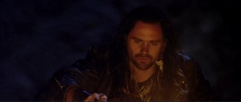 Movie still from “Point Break” (1991), directed by Kathryn Bigelow – A person with long black hair; Close Up shot, Low angle