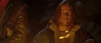 Movie still from “Point Break” (1991), directed by Kathryn Bigelow – A person with long hair; Close Up shot, Low angle