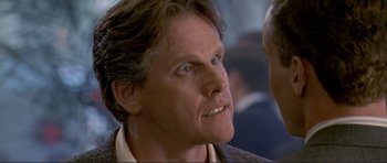 Movie still from “Point Break” (1991), directed by Kathryn Bigelow – A person looking at the camera; Close Up shot, Over the shoulder angle