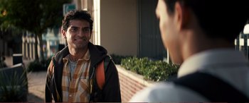 Movie still from “Pokémon: Detective Pikachu” (2019), directed by Rob Letterman – A man standing next to another man on a sidewalk; Close Up shot, Over the shoulder angle