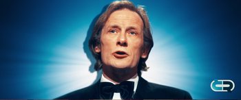 Movie still from “Pokémon: Detective Pikachu” (2019), directed by Rob Letterman – A wax statue of a man in a suit and bow tie; Close Up shot, Low angle