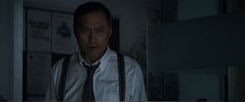 Movie still from “Pokémon: Detective Pikachu” (2019), directed by Rob Letterman – A man wearing a striped tie and a white shirt; Close Up shot, Low angle