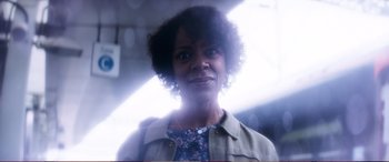 Movie still from “Pokémon: Detective Pikachu” (2019), directed by Rob Letterman – A person smiling for the camera; Close Up shot, Low angle