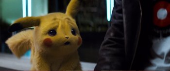Movie still from “Pokémon: Detective Pikachu” (2019), directed by Rob Letterman – A stuffed animal pikachu; Close Up shot, High angle