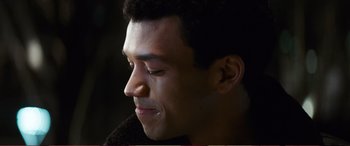 Movie still from “Pokémon: Detective Pikachu” (2019), directed by Rob Letterman – A person with his eyes closed; Close Up shot, Over the shoulder angle