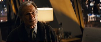 Movie still from “Pokémon: Detective Pikachu” (2019), directed by Rob Letterman – An older man wearing a suit and a tie; Close Up shot, Low angle