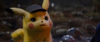 Movie still from “Pokémon: Detective Pikachu” (2019), directed by Rob Letterman – A stuffed animal wearing a hat; Close Up shot, High angle