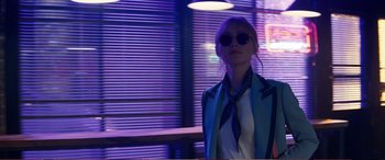 Movie still from “Pokémon: Detective Pikachu” (2019), directed by Rob Letterman – A woman wearing a blue jacket and a blue tie; Medium shot, Low angle