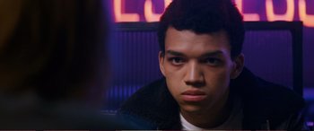 Movie still from “Pokémon: Detective Pikachu” (2019), directed by Rob Letterman – A young man is looking into the camera; Close Up shot, Over the shoulder angle