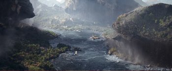 Movie still from “Pokémon: Detective Pikachu” (2019), directed by Rob Letterman – A view of a body of water with mountains in the background; Extreme Wide shot, High angle