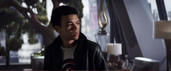 Movie still from “Pokémon: Detective Pikachu” (2019), directed by Rob Letterman – A man in a leather jacket looking to his left; Close Up shot, Over the shoulder angle