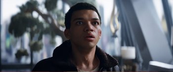 Movie still from “Pokémon: Detective Pikachu” (2019), directed by Rob Letterman – A young man looking up into the sky; Close Up shot, Low angle