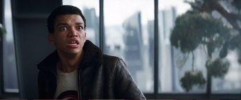 Movie still from “Pokémon: Detective Pikachu” (2019), directed by Rob Letterman – A man in a leather jacket looking at the camera; Close Up shot, Low angle