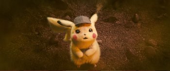Movie still from “Pokémon: Detective Pikachu” (2019), directed by Rob Letterman – A stuffed pikachu wearing a baseball cap; Close Up shot, High angle
