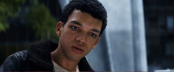 Movie still from “Pokémon: Detective Pikachu” (2019), directed by Rob Letterman – A person wearing a jacket; Close Up shot, High angle