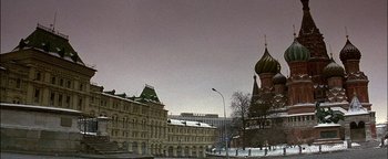 Movie still from “First Strike” (1996), directed by Stanley Tong – A large building with a large church in the background; Extreme Wide shot, Low angle
