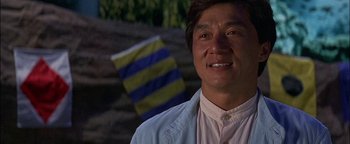 Movie still from “First Strike” (1996), directed by Stanley Tong – A person wearing a shirt; Close Up shot, Low angle