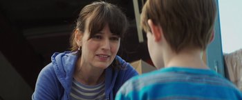 Movie still from “Poltergeist” (2015), directed by Gil Kenan – A woman talking to a young boy in front of a window; Close Up shot, Over the shoulder angle