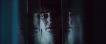 Movie still from “Poltergeist” (2015), directed by Gil Kenan – A person's face in front of a mirror; Close Up shot, Low angle