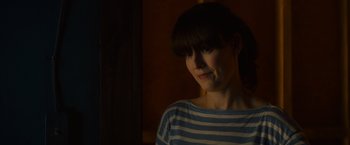Movie still from “Poltergeist” (2015), directed by Gil Kenan – A person wearing a striped t - shirt; Close Up shot, Over the shoulder angle