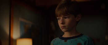 Movie still from “Poltergeist” (2015), directed by Gil Kenan – A young boy is looking into the distance; Close Up shot, Low angle