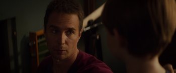 Movie still from “Poltergeist” (2015), directed by Gil Kenan – A person looking at the camera; Close Up shot, Over the shoulder angle