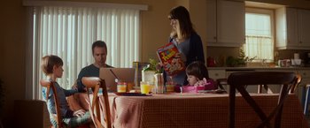 Movie still from “Poltergeist” (2015), directed by Gil Kenan – A woman and a child are sitting at a table with cereal; Medium shot, Over the shoulder angle