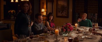Movie still from “Poltergeist” (2015), directed by Gil Kenan – A group of people sitting around a dinner table; Medium shot, Over the shoulder angle