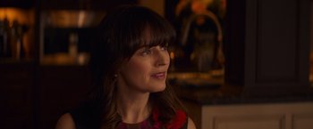 Movie still from “Poltergeist” (2015), directed by Gil Kenan – A person wearing a red and black dress; Close Up shot, Over the shoulder angle