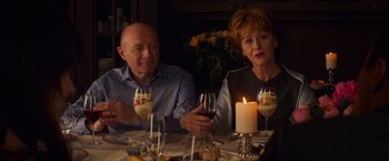 Movie still from “Poltergeist” (2015), directed by Gil Kenan – A man and a woman sitting at a dinner table; Medium shot, Over the shoulder angle