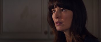 Movie still from “Poltergeist” (2015), directed by Gil Kenan – A person with long brown hair; Close Up shot, Over the shoulder angle