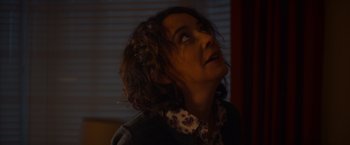 Movie still from “Poltergeist” (2015), directed by Gil Kenan – A woman looking up into the sky at night; Close Up shot, Low angle