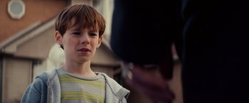 Movie still from “Poltergeist” (2015), directed by Gil Kenan – A young boy is looking into the distance; Close Up shot, Over the shoulder angle