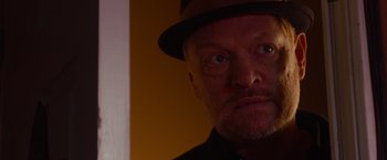 Movie still from “Poltergeist” (2015), directed by Gil Kenan – A person wearing a hat; Close Up shot, Low angle